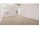 Spacious carpeted bedroom with ceiling fan and large windows at 1718 Lacebark Elm Way, Lawrenceville, GA 30045