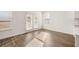 Breakfast nook with wood-look floors and access to backyard at 1718 Lacebark Elm Way, Lawrenceville, GA 30045