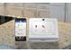 Image of a smart home security system with touchscreen panel and mobile app at 1718 Lacebark Elm Way, Lawrenceville, GA 30045