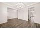Open dining room with hardwood floors and access to kitchen at 1718 Lacebark Elm Way, Lawrenceville, GA 30045