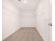 Spacious walk-in closet with wire shelving and neutral carpeting at 1718 Lacebark Elm Way, Lawrenceville, GA 30045