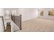 Open loft area with neutral carpeting and large windows at 1718 Lacebark Elm Way, Lawrenceville, GA 30045