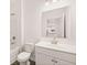 Clean bathroom with white vanity, toilet, and bathtub at 1718 Lacebark Elm Way, Lawrenceville, GA 30045