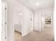 Bright hallway with access to bedrooms and bathroom at 1718 Lacebark Elm Way, Lawrenceville, GA 30045