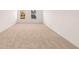 Spacious carpeted bedroom with two large windows at 1718 Lacebark Elm Way, Lawrenceville, GA 30045
