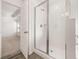Modern bathroom with a glass shower and white subway tile at 1718 Lacebark Elm Way, Lawrenceville, GA 30045
