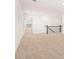 Spacious loft area with neutral carpet and an open layout at 1718 Lacebark Elm Way, Lawrenceville, GA 30045