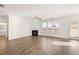 Bright living room with fireplace and hardwood floors at 1718 Lacebark Elm Way, Lawrenceville, GA 30045