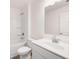 Clean bathroom with white vanity and bathtub at 1718 Lacebark Elm Way, Lawrenceville, GA 30045