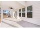 Covered patio with ceiling fan; view of backyard at 1718 Lacebark Elm Way, Lawrenceville, GA 30045