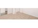 Bright bedroom with neutral carpeting and access to hallway at 1718 Lacebark Elm Way, Lawrenceville, GA 30045