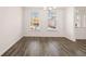 Spacious dining area with hardwood floors and large windows at 1718 Lacebark Elm Way, Lawrenceville, GA 30045