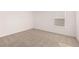 Simple bedroom with neutral walls and carpet at 1718 Lacebark Elm Way, Lawrenceville, GA 30045