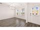 Formal dining room features wood-look floors and natural light at 1718 Lacebark Elm Way, Lawrenceville, GA 30045