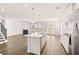Modern kitchen features a large island and stainless steel appliances at 1718 Lacebark Elm Way, Lawrenceville, GA 30045