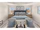 Spacious main bedroom with plush bed and sitting area at 6375 Rosetta Dr # 86, South Fulton, GA 30331