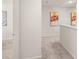 Hallway with doors to bedrooms and a half bath at 6375 Rosetta Dr # 86, South Fulton, GA 30331