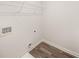 Laundry room with vinyl flooring and overhead shelving at 6375 Rosetta Dr # 86, South Fulton, GA 30331