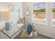 Well-lit home office space with glass desk and window views at 6375 Rosetta Dr # 86, South Fulton, GA 30331