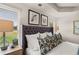 Main bedroom with a large headboard and window view at 6375 Rosetta Dr # 86, South Fulton, GA 30331