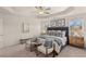 Bright main bedroom featuring a king-size bed and ceiling fan at 6375 Rosetta Dr # 86, South Fulton, GA 30331