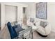 Spacious home office with a glass desk and two armchairs at 6375 Rosetta Dr # 86, South Fulton, GA 30331