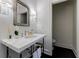 Stylish bathroom with marble vanity and antique mirror at 2880 Bakers Farm Se Rd, Atlanta, GA 30339