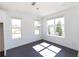 Light-filled breakfast nook with dark hardwood floors and large windows at 709 Dodd Ln # 165, Buford, GA 30518