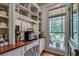 Well-organized pantry with custom shelving and a large window at 114 Trinity Hollow Dr, Canton, GA 30115