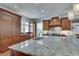 Modern kitchen with granite countertops and custom wood cabinetry at 114 Trinity Hollow Dr, Canton, GA 30115