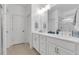Double vanity bathroom with white cabinets, quartz countertops, and a large walk-in shower at 205 Lakeside Pl, Canton, GA 30114
