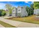Townhouse with gray siding and attached garage at 205 Lakeside Pl, Canton, GA 30114