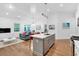 Open concept kitchen with island, stainless steel appliances, and hardwood floors at 205 Lakeside Pl, Canton, GA 30114