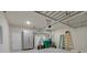 Garage with overhead storage, cabinets, and ample space for tools and equipment at 205 Lakeside Pl, Canton, GA 30114