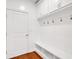 Laundry area with built-in shelving and hanging hooks at 205 Lakeside Pl, Canton, GA 30114