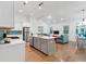 Open concept kitchen with island, stainless steel appliances, and hardwood floors at 205 Lakeside Pl, Canton, GA 30114