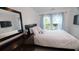 Spacious bedroom with large windows and a mirrored dresser at 205 Lakeside Pl, Canton, GA 30114