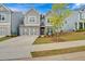 Gray two-story house with stone accents and landscaping at 205 Lakeside Pl, Canton, GA 30114
