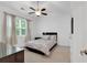 Bright bedroom with window, ceiling fan, and neutral decor at 205 Lakeside Pl, Canton, GA 30114