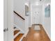 Bright entryway with hardwood floors, staircase, and neutral walls at 205 Lakeside Pl, Canton, GA 30114