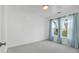 Simple bedroom with light blue curtains and a window at 205 Lakeside Pl, Canton, GA 30114