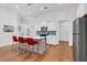Open concept kitchen with island, stainless steel appliances and hardwood floors at 205 Lakeside Pl, Canton, GA 30114
