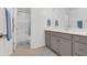 Bathroom boasts a double vanity and a tub shower combo at 205 Lakeside Pl, Canton, GA 30114