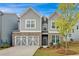 Two-story home with gray siding and stone accents at 205 Lakeside Pl, Canton, GA 30114