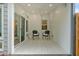 Relaxing covered patio with tile flooring, ceiling fan, and comfortable seating at 205 Lakeside Pl, Canton, GA 30114