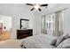 Spacious bedroom with dresser and view into adjacent room at 205 Lakeside Pl, Canton, GA 30114
