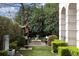 Serene garden with sculptures, hedges, and a stone fountain at 2440 Peachtree Nw Rd # 1, Atlanta, GA 30305