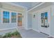 Covered back porch with light gray siding and French doors at 1284 Six Sisters St, Dacula, GA 30019