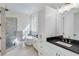 Luxurious bathroom with soaking tub, walk-in shower, and modern vanity at 1284 Six Sisters St, Dacula, GA 30019