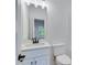 Clean bathroom with white vanity and rectangular mirror at 1284 Six Sisters St, Dacula, GA 30019